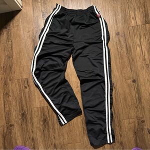 Baggy black and white striped adidas type track pants